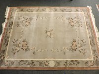 Lot 557 - A Chinese plush ground carpet