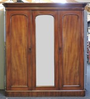 Lot 610 - A Victorian mahogany triple door wardrobe