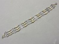 Lot 54 - An Art Deco three row graduated cultured pearl bracelet