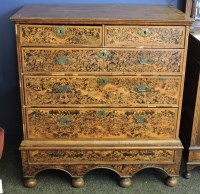 Lot 551 - A walnut and burr wood chest on stand