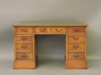 Lot 606 - A reproduction pale mahogany twin pedestal desk