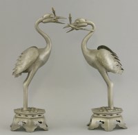 Lot 169 - A pair of pewter Crane Candlesticks