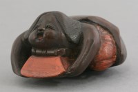 Lot 367 - A lacquered wood Netsuke