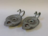 Lot 209 - A pair of Egyptian style bronze oil lamps