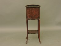 Lot 597 - A simulated walnut square shaped jardinière stand