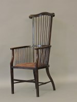 Lot 607 - An 'Arts and Crafts' stick back armchair