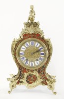 Lot 299 - A mahogany and gilt brass mantel clock