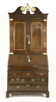 Lot 386 - A walnut bureau bookcase