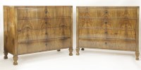 Lot 435 - A matched pair of Biedermeier walnut four-drawer commodes