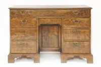 Lot 360 - A solid yew wood single piece kneehole desk