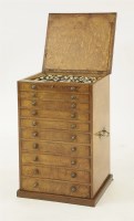 Lot 61 - A crossbanded amboyna tabletop specimen chest