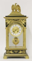 Lot 290 - A French Empire four-glass mantel clock