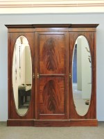 Lot 635 - A late 19th century mahogany breakfront triple wardrobe