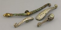 Lot 356 - A collection of four belt hooks