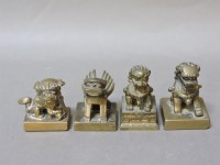 Lot 89 - Four Chinese bronze dogs as seals