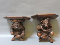 Lot 461 - A pair of French carved walnut wall brackets