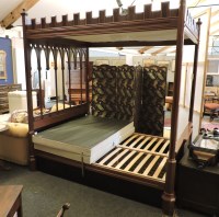 Lot 479 - A reproduction Gothic mahogany four poster bed