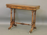 Lot 480 - A Victorian walnut card table