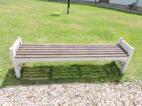 Lot 529 - A slatted garden seat