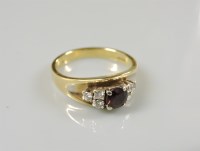 Lot 38 - An 18ct gold garnet ring