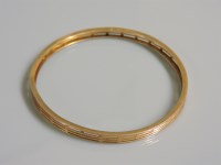 Lot 21 - An Art Deco 9ct gold four row bangle