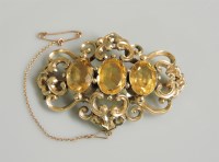 Lot 24 - A Victorian three stone citrine brooch