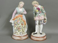 Lot 185 - A pair of Sitzendorf porcelain figures of a gentleman and a lady