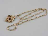 Lot 43 - A Victorian gold garnet set brooch