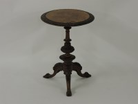 Lot 445 - A Victorian walnut tripod table