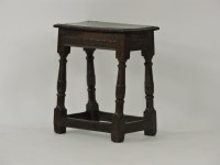 Lot 472 - An oak joint stool