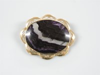 Lot 22 - A 9ct gold blue John oval brooch