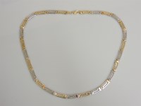 Lot 17 - A two coloured gold Greek key link necklace