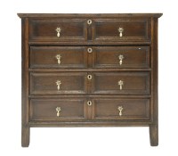 Lot 324 - A panelled and moulded oak chest