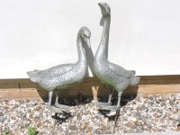 Lot 553 - A pair of cast metal garden ornaments