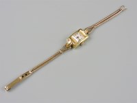 Lot 28 - An 18ct gold ladies Vertex mechanical strap watch