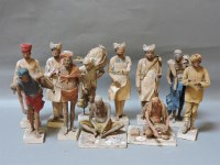 Lot 242 - A collection of late 19th/early 20th century Indian clay figures of tradesmen