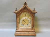 Lot 337 - A late 19th century oak eight day striking bracket clock