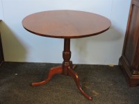 Lot 421 - A George III figured oak tripod table