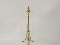 Lot 454 - An aesthetic brass adjustable oil lamp