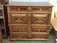 Lot 426 - A Jacobean oak chest of four long drawers