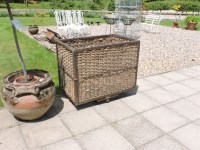 Lot 547 - A wicker and iron framed basket