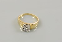 Lot 26 - A gold four stone diamond ring