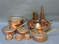 Lot 311 - A collection of copper and brass saucepans