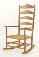 Lot 91 - A Cotswold School ladder back rocking chair
