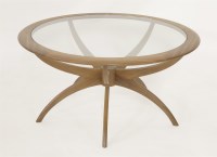 Lot 465 - A teak circular coffee table