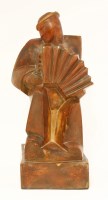 Lot 149 - A figure of a man playing an accordian