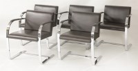 Lot 744 - A set of ten contemporary chocolate leather and chrome dining chairs