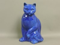 Lot 137 - An old blue glazed seated cat