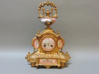 Lot 99 - A French gilt metal and Paris porcelain mounted mantel clock