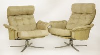 Lot 446 - A pair of leather and suede armchairs